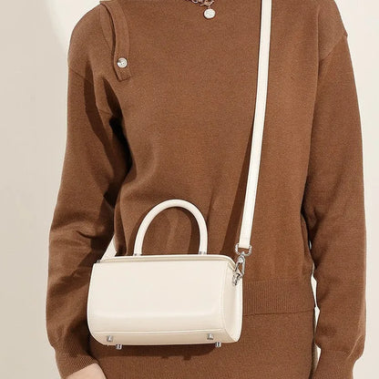 Genuine cowhide leather women's crossbody bag with clamshell opening and internal organisation compartments