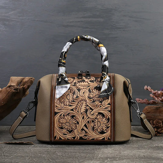 Vintage leather messenger bag with textured carving, first layer cowhide construction, and multiple internal pockets including zipper compartments
