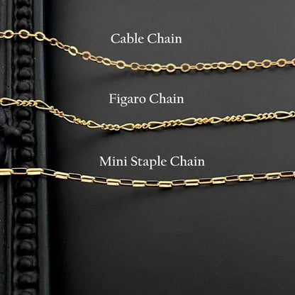 Titanium steel ghost pendant necklace on a 45cm stainless steel chain with electroplated finish, available in cable, figaro, or mini staple styles.