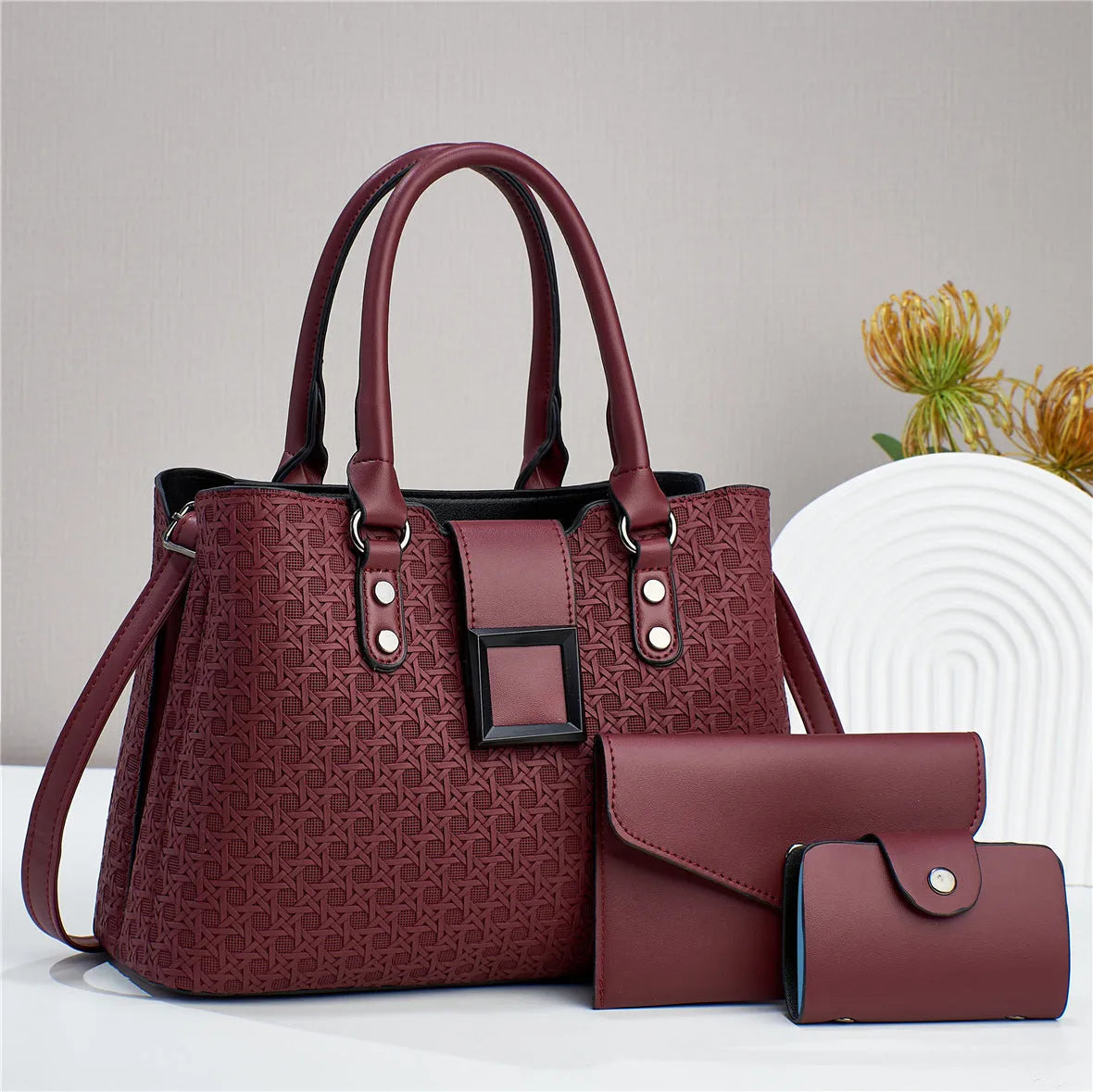 Textured PU leather three-piece women's crossbody bag in a square vertical shape, shown in apricot colour.