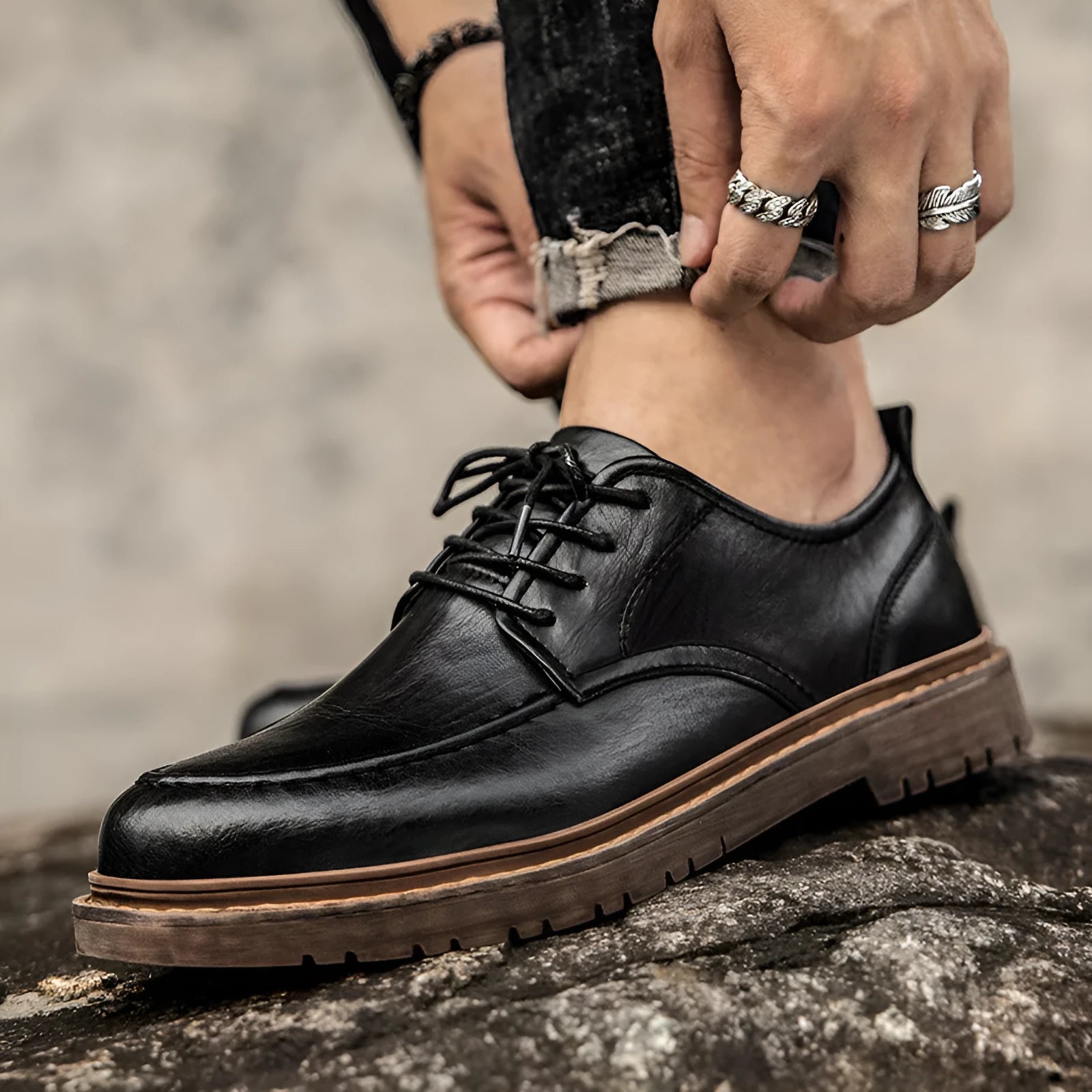 Brown casual leather shoes with round toe, flat heel, and visible sewing lines on the cowhide upper.