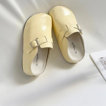 Flat buckle casual sneakers in beige, black, silver, and yellow colours, showing round toe and PU upper.