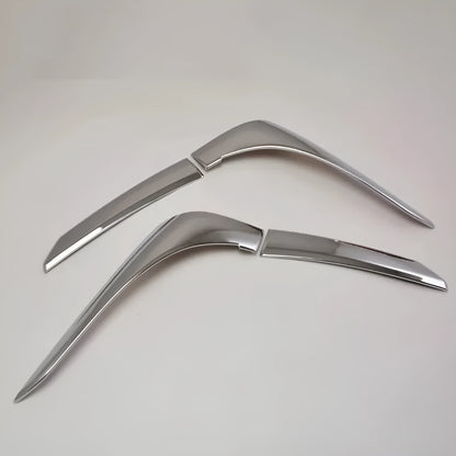 Set of four silver electroplated tail light eyebrow trims for Mitsubishi Outlander on white background.