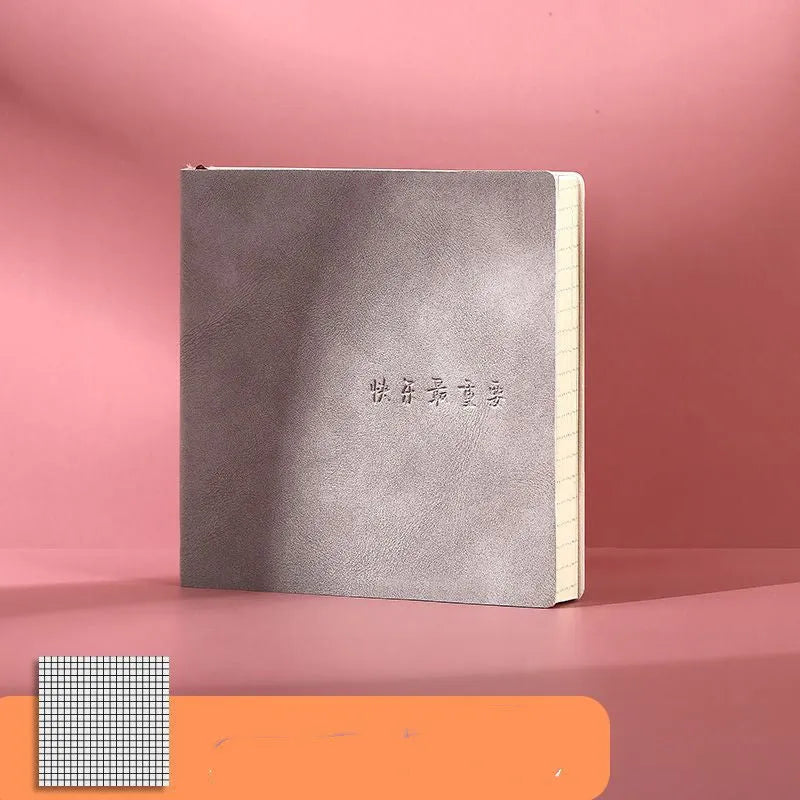 Square faux leather mesh cover notebook open on a blank Daolin paper page.