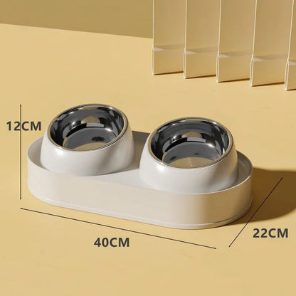 White elevated pet double bowl feeder with tilted food and water bowls on a non-slip stand.