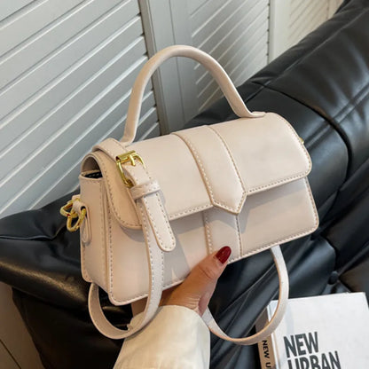 Women's beige messenger bag with horizontal square design showing file compartment and exterior pocket
