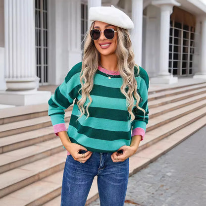 Women's loose fit striped long sleeve round neck sweater on a hanger.