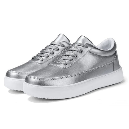 Women's lightweight leather flat casual shoes in gold colour with front lace-up design on a white background