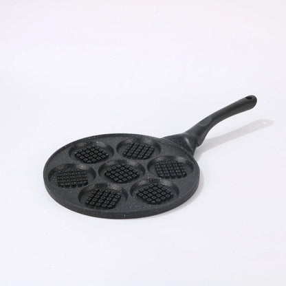 Seven-hole aluminium barbecue plate with non-stick surface on gas hob