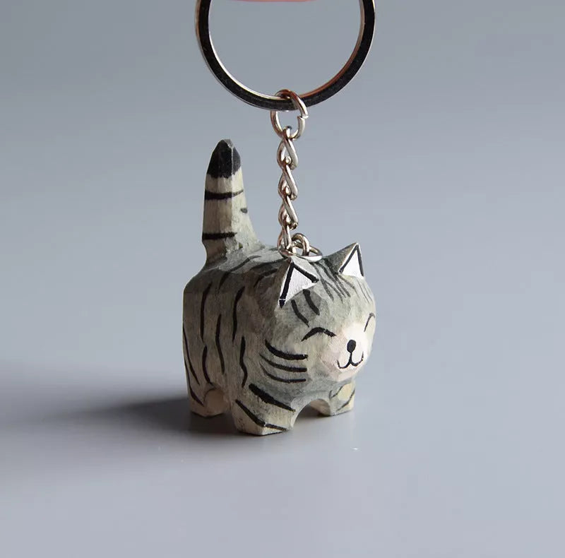 Handmade wooden cat trinkets in gray and orange, perfect for decor or gifts