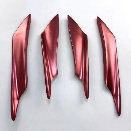 Set of four carbon fibre pattern ABS plastic bumper blades for car modification.