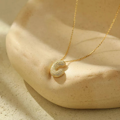 Stainless steel initial pendant necklace with zircon accents, personalized with your choice of letter.