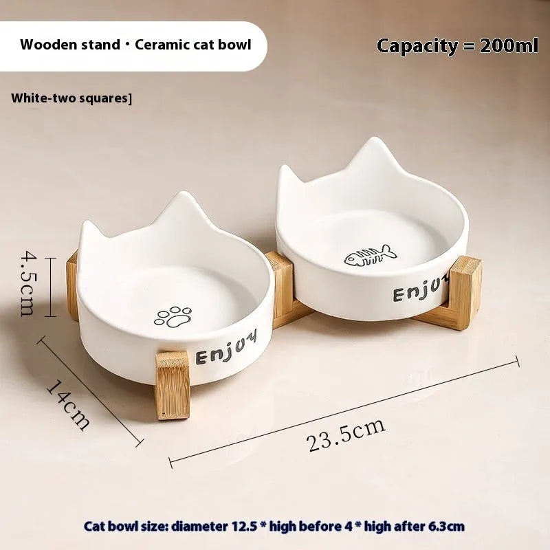 Porcelain cat bowl with anti-tumble wooden frame in pink with a cat paw design