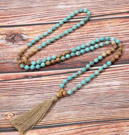 Handcrafted natural stone bracelet with alloy volcano white turquoise charm in a simple design.