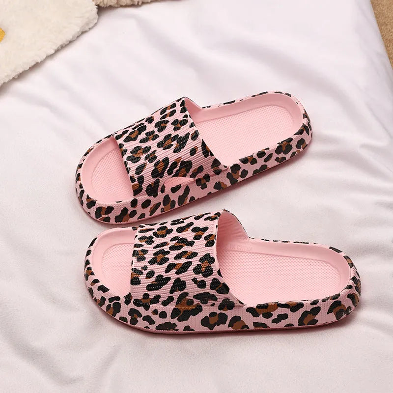 Women's leopard print slippers with a thick EVA sole in multiple colour options on a white background.