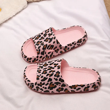 Women's leopard print slippers with a thick EVA sole in multiple colour options on a white background.