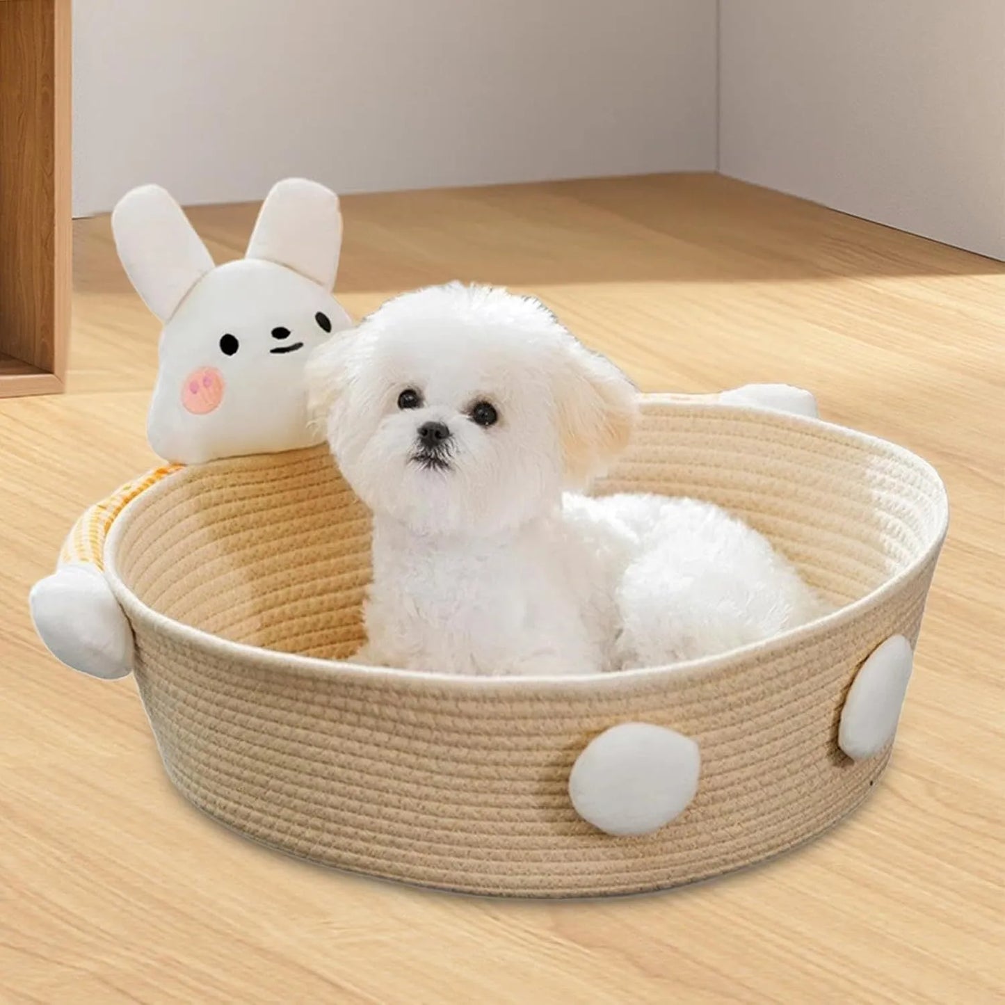 Woven cotton rope basket serving as a pet bed and integrated scratch board for cats, shown in a beige colour.