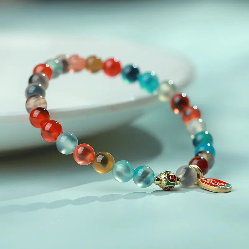Women's natural agate bracelet with copper coin snake elements in geometric design