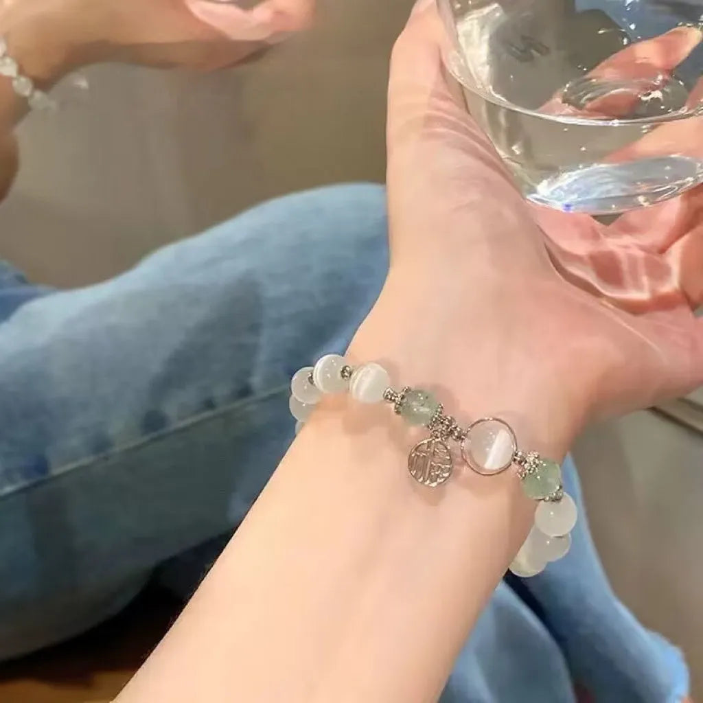 Handmade glass butterfly bracelet with drop-shaped beads in moonlight grey colour variation
