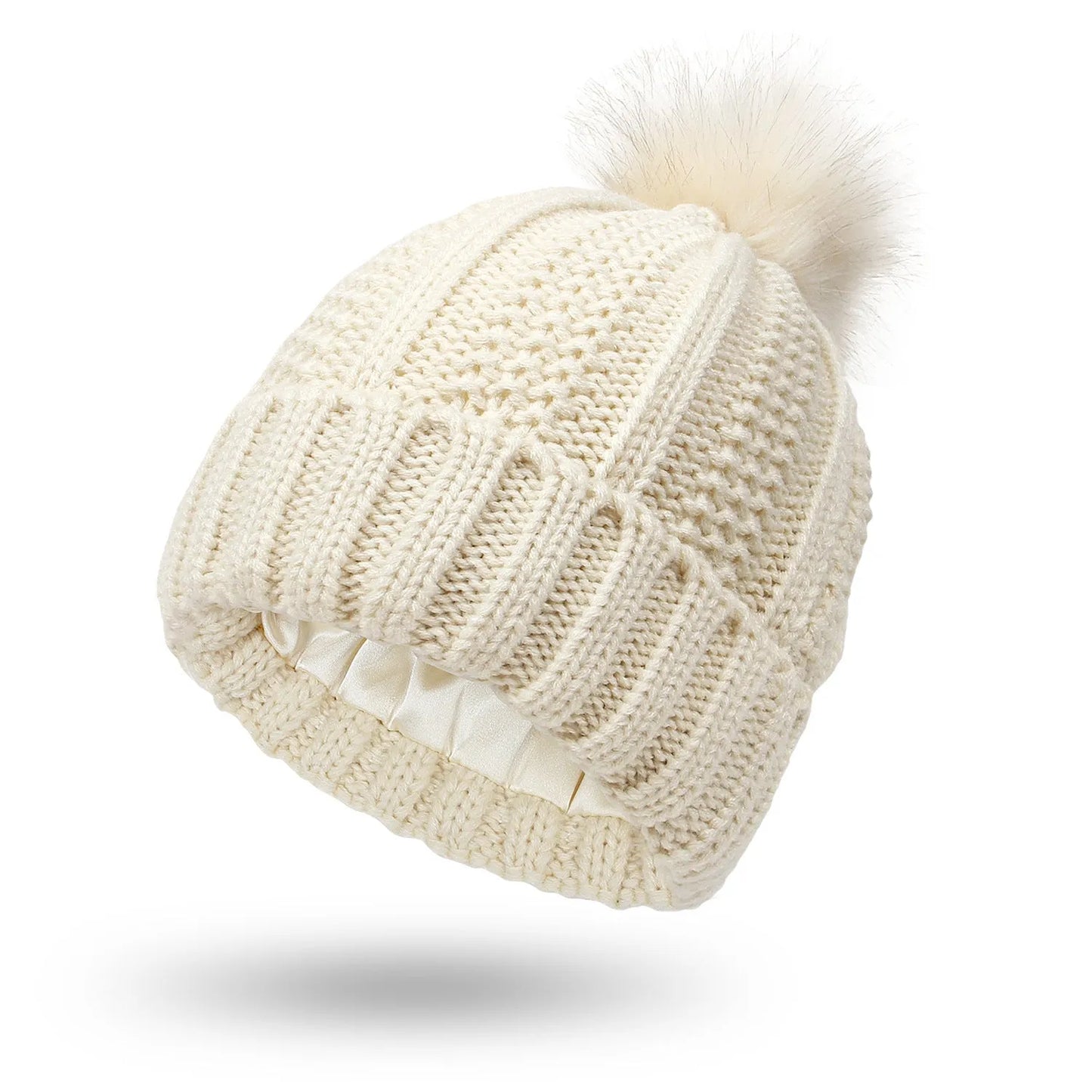 Wool knit beanie hat for women with faux fur pom pom and satin lining, shown in a wine red colour.