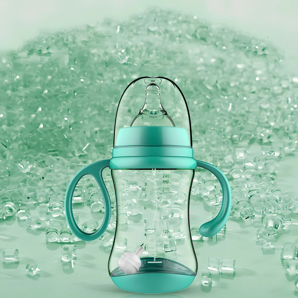 Baby feeding bottle with curved double handles in blue or pink, showing wide caliber opening and transparent PP construction