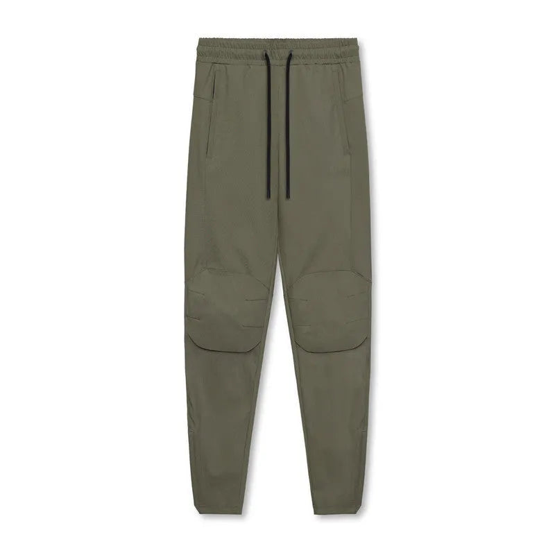 Men's grey fitness trousers with ankle ties, made from quick-drying polyester, for exercise and casual use.