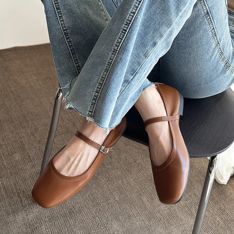 Women's brown sheepskin Mary Jane flat shoes with a round toe and strap