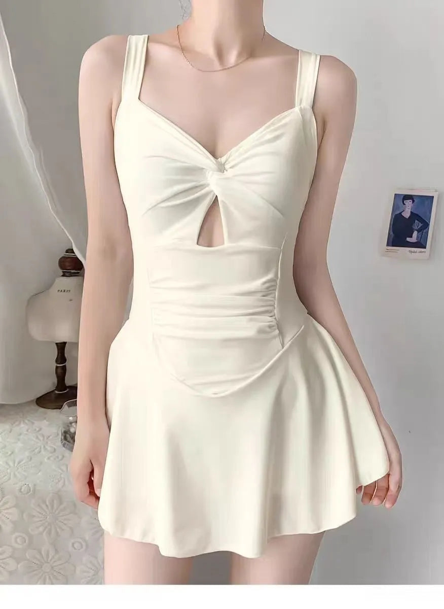 Solid colour one-piece swimsuit for women showing backless conservative design on a mannequin.