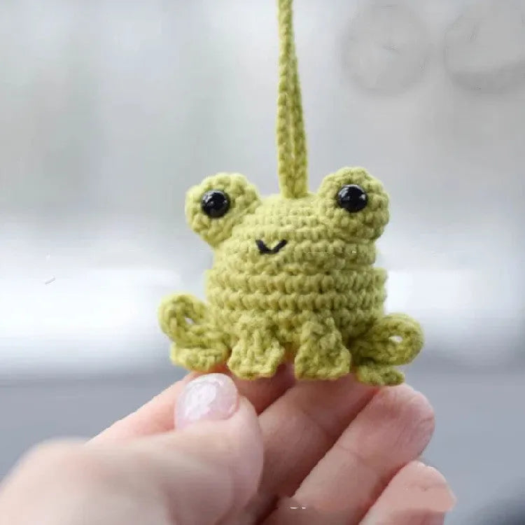 Handmade woven frog car pendant in plush material measuring 5cm wide