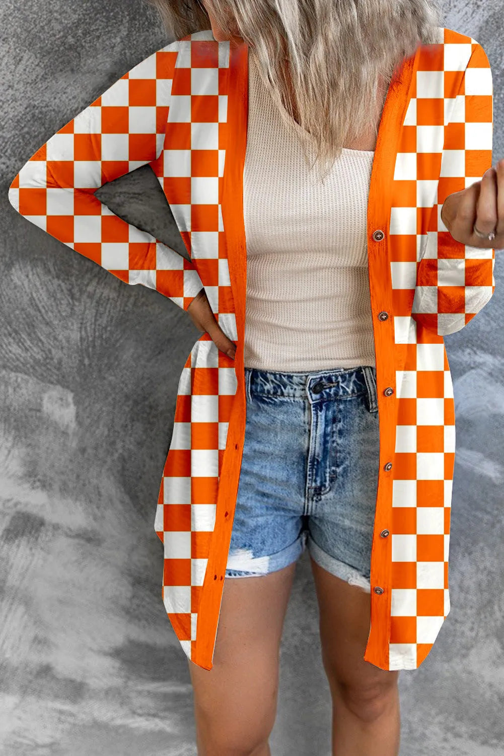 Women's long grey plaid knitted cardigan coat with loose fit and regular sleeves on a hanger