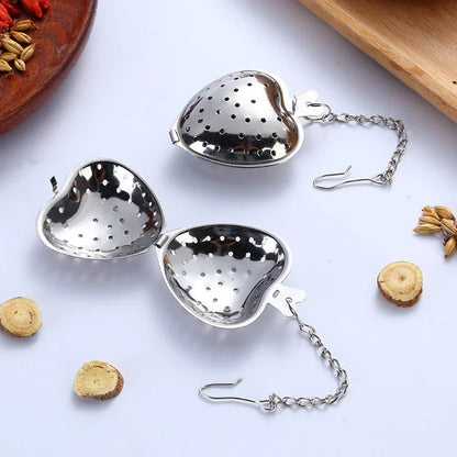 Premium stainless steel tea infuser with heart-shaped design, suitable for brewing loose-leaf teas, herbs, and spices
