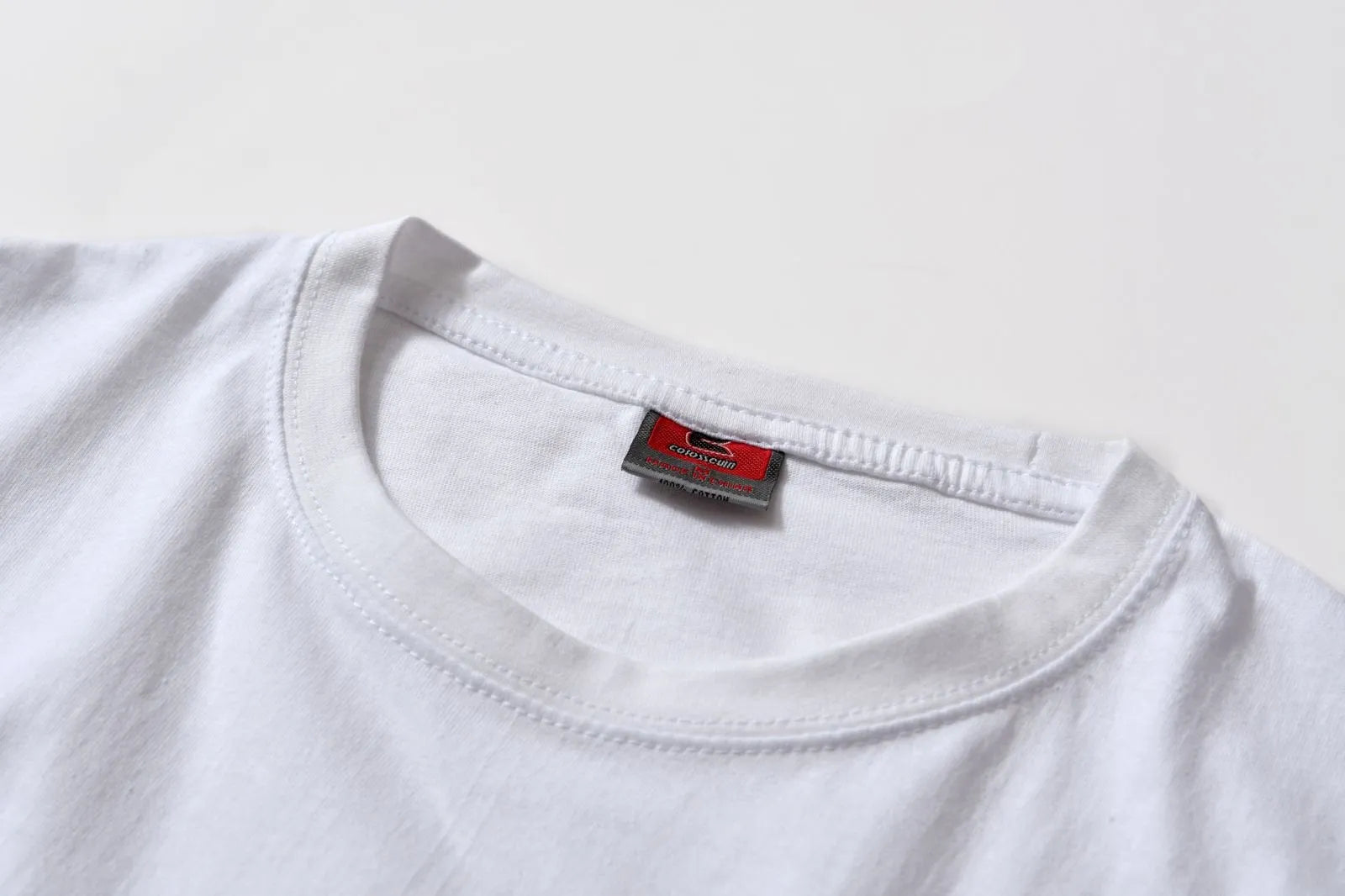 White cotton pullover overalls with a pattern, short sleeves, and a round neck on a teenager.
