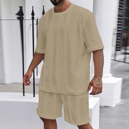Knitted short-sleeve pullover and matching shorts set in light grey, laid flat.