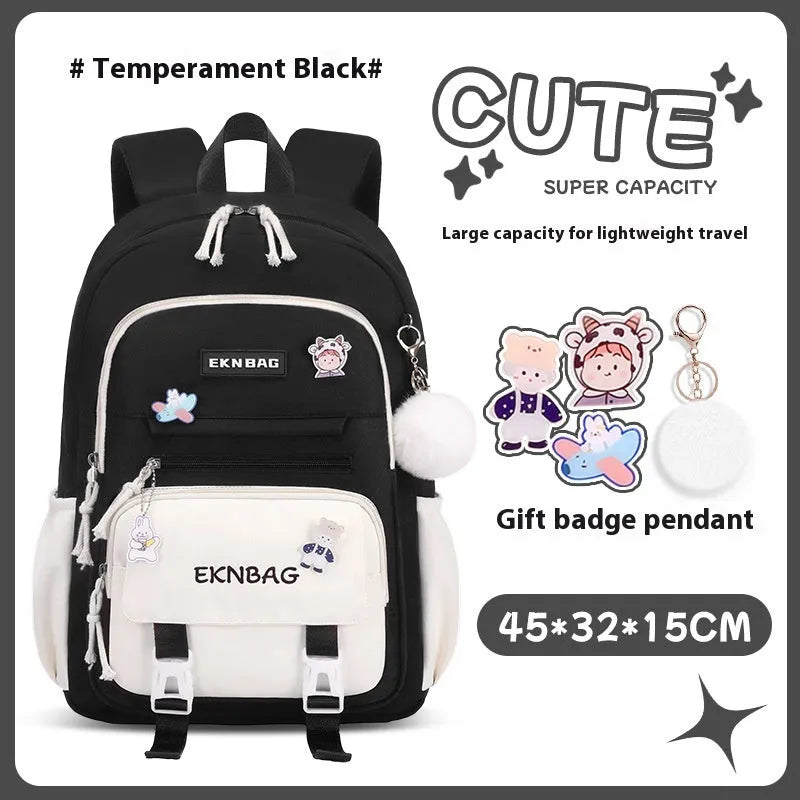 Pink waterproof Oxford cloth school backpack for girls with curved shoulder straps, shown with matching pencil case.