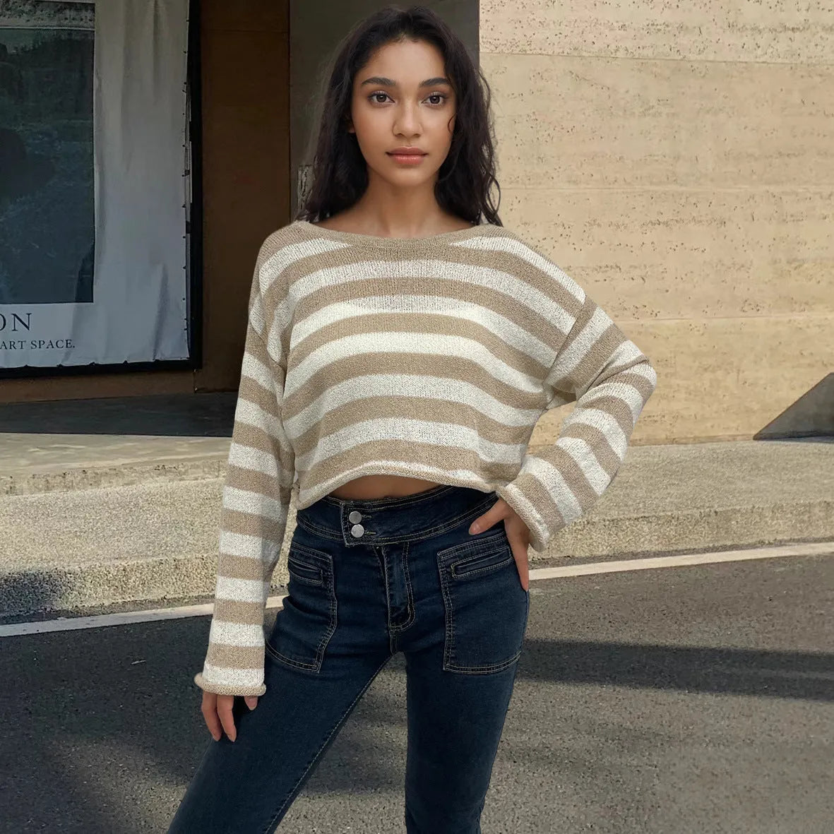 Reversible black and white striped cropped sweater shown worn both front and back.