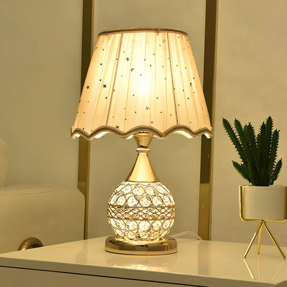 Gold crystal desk lamp 30cm tall with remote switch on bedside table, diffusing even light via manual-cut pendants