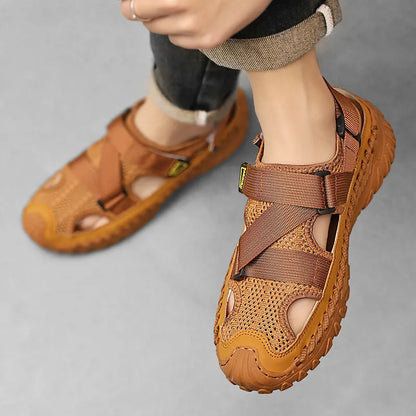 Men's grey casual sandals with hollow mesh upper, elastic band, and rubber sole.