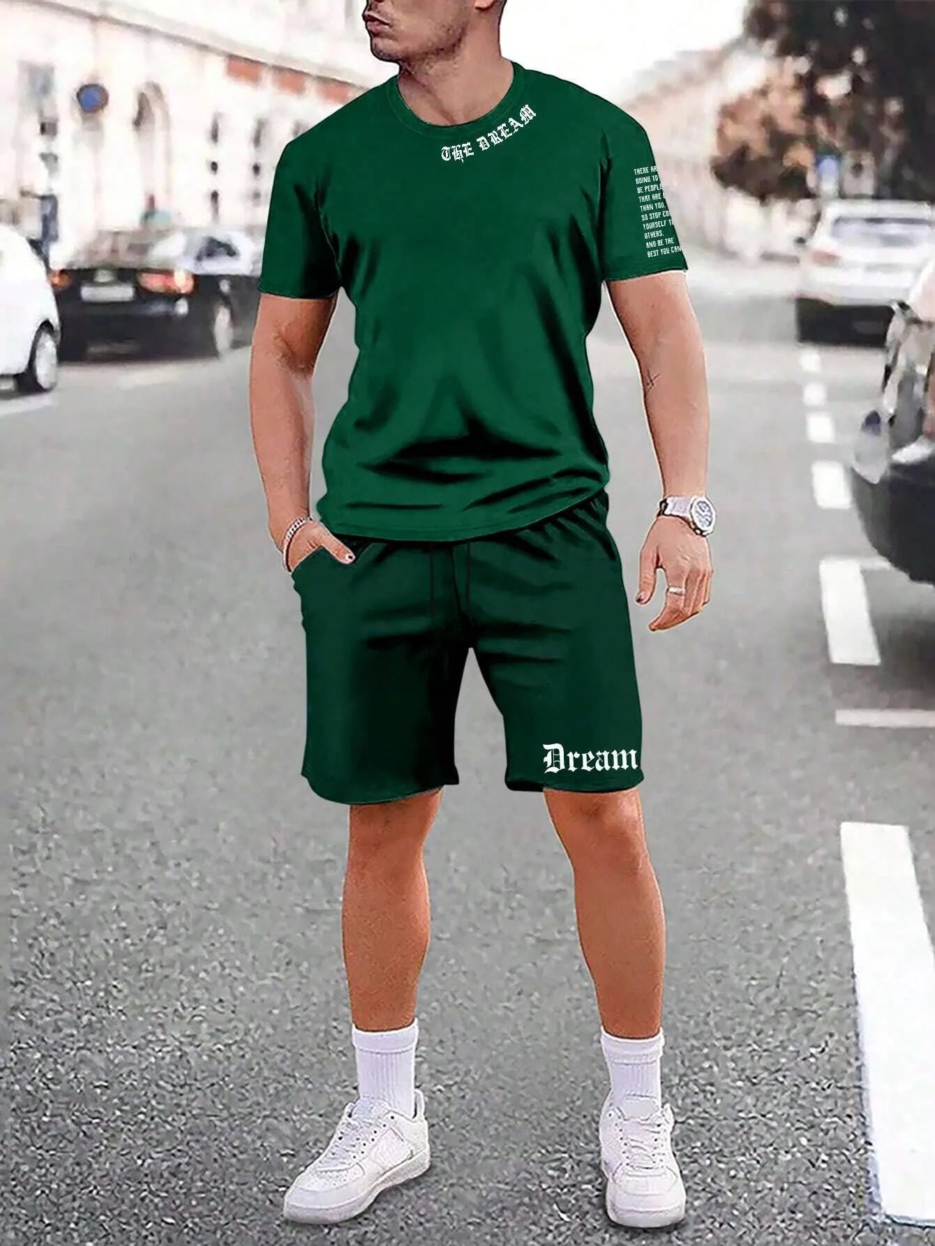 Man wearing a printed short-sleeve top and matching shorts from the sports style two-piece set.