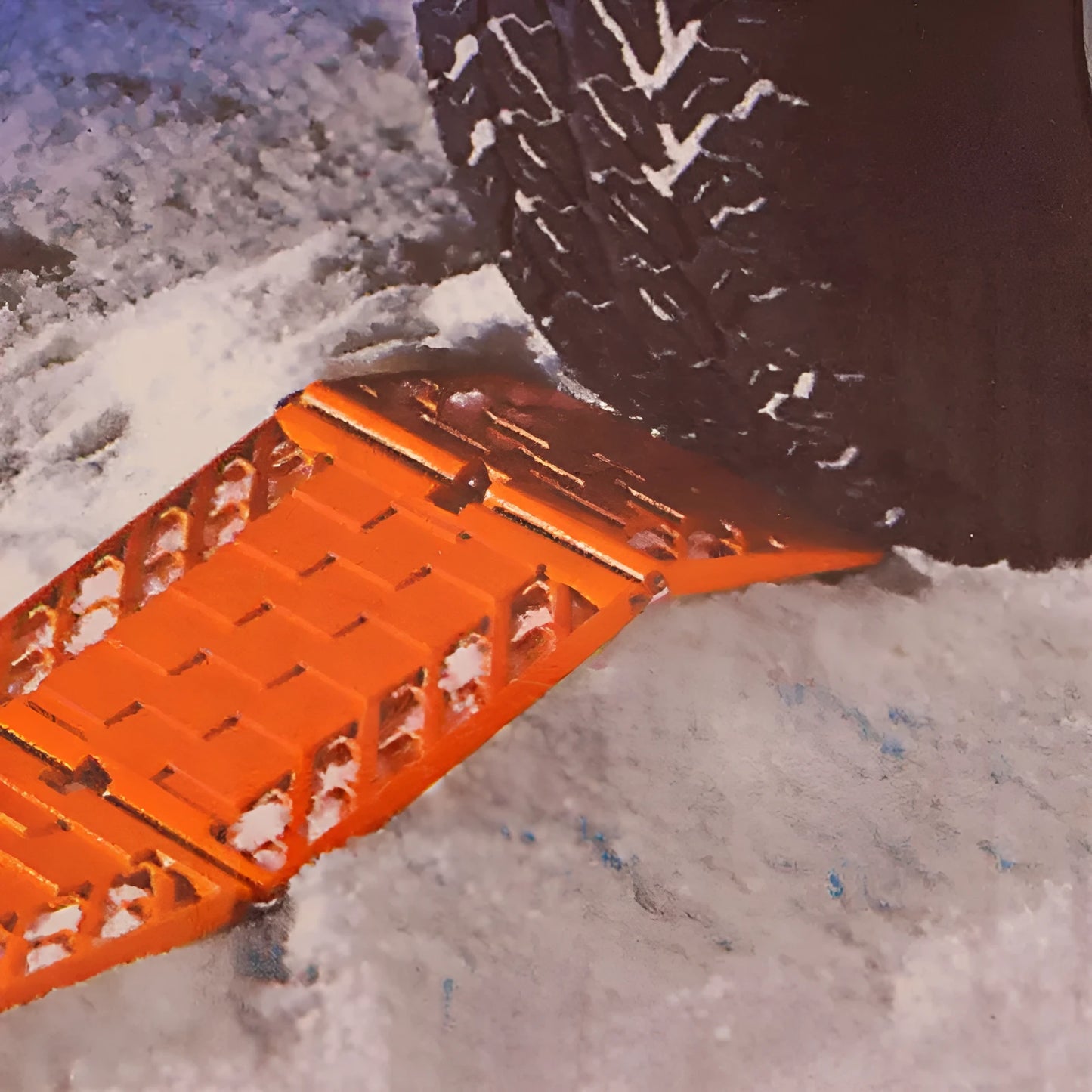 Pair of orange folding anti-slip car rescue boards for snow and mud recovery