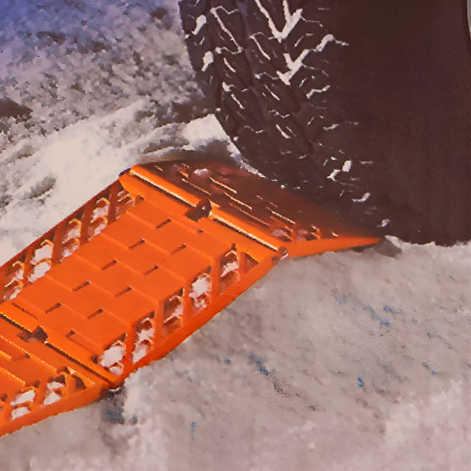 Pair of orange folding anti-slip car rescue boards for snow and mud recovery