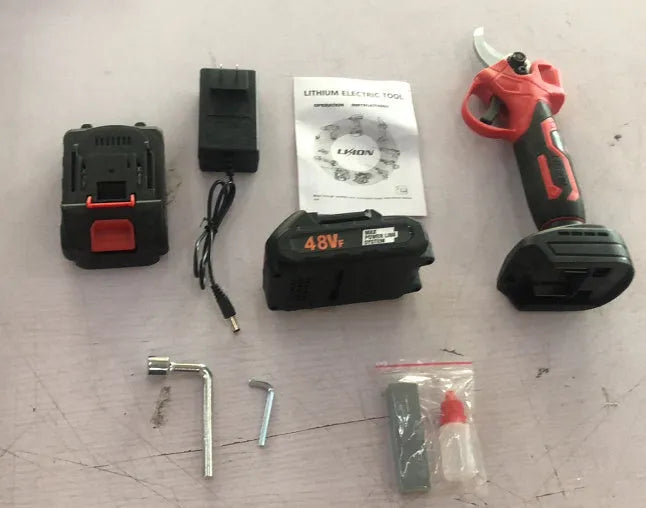 Cordless electric pruning knife with lithium batteries in plastic storage box