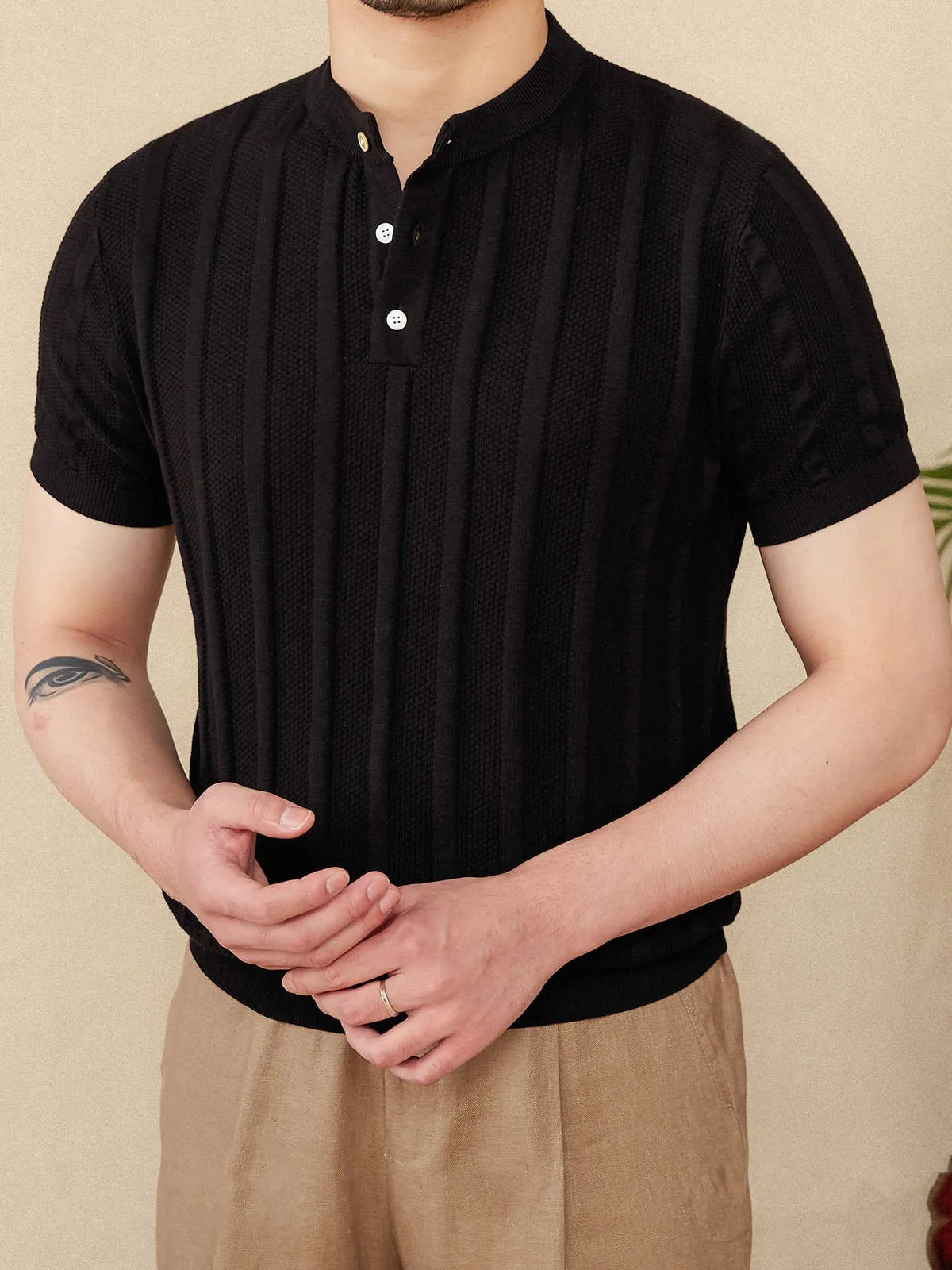 Men's beige cotton short-sleeve T-shirt with a Henry collar and a subtle sunken stripe knitted pattern.