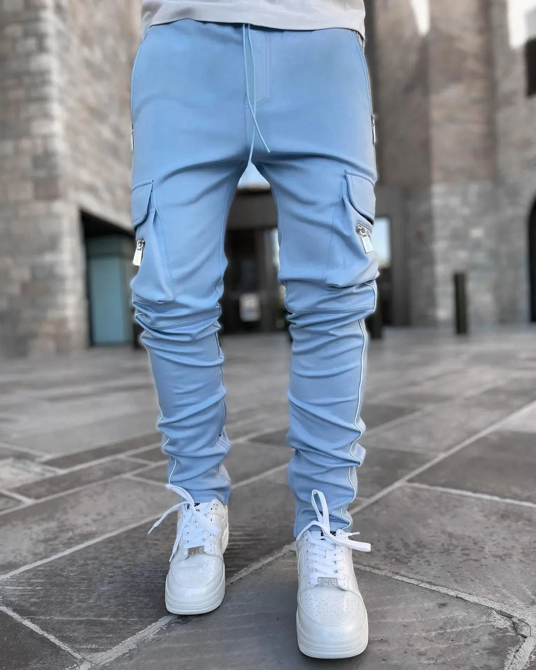 Men's multi-pocket cargo pants in khaki cotton blend with stretch fabric, mid-waist, small feet cuff, athleisure style.
