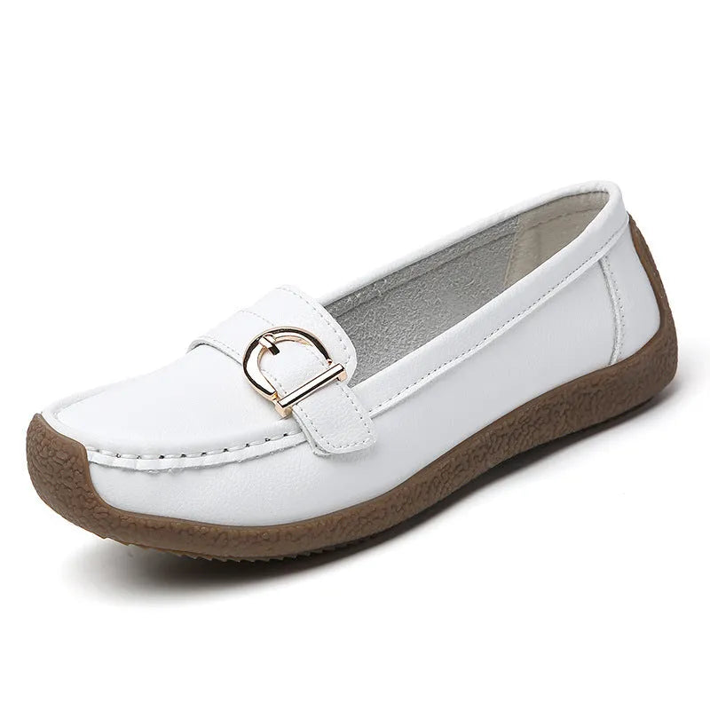Women's beige casual loafers with round toe and flat heel on a white background.