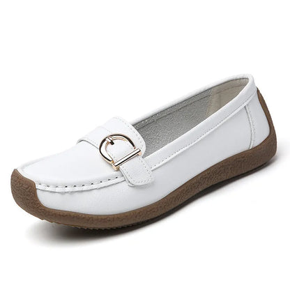 Women's beige casual loafers with round toe and flat heel on a white background.