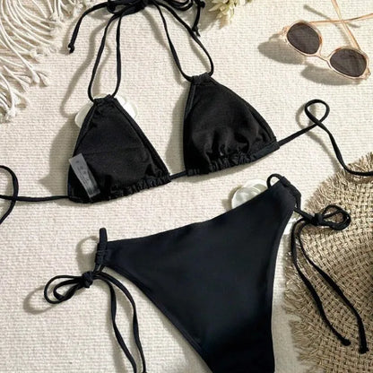 Black women's bikini set with 3D flower lace detailing and an adjustable drawstring waist.