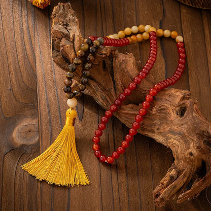 Vintage bohemian-style long beaded sweater chain with a tassel, showing necklace and bracelet lengths.