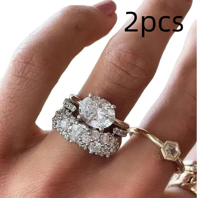 Women's white geometric alloy ring three-piece set with mosaic oval zircon detail, shown in sizes 6 to 10.