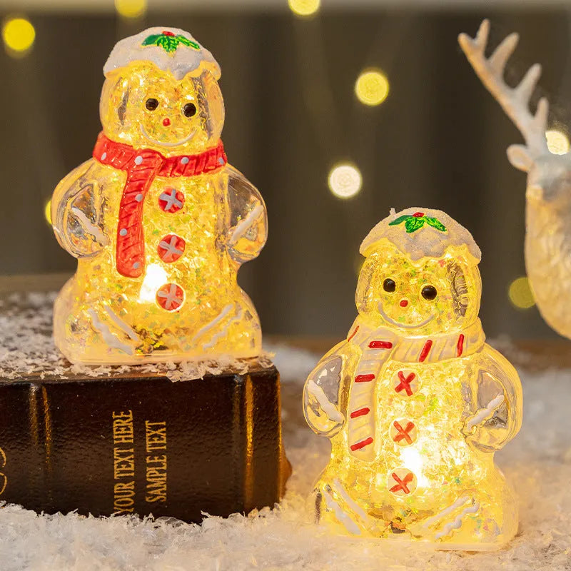 Glowing gingerbread man Christmas ornament measuring 6.5cm wide with LED lights and red scarf