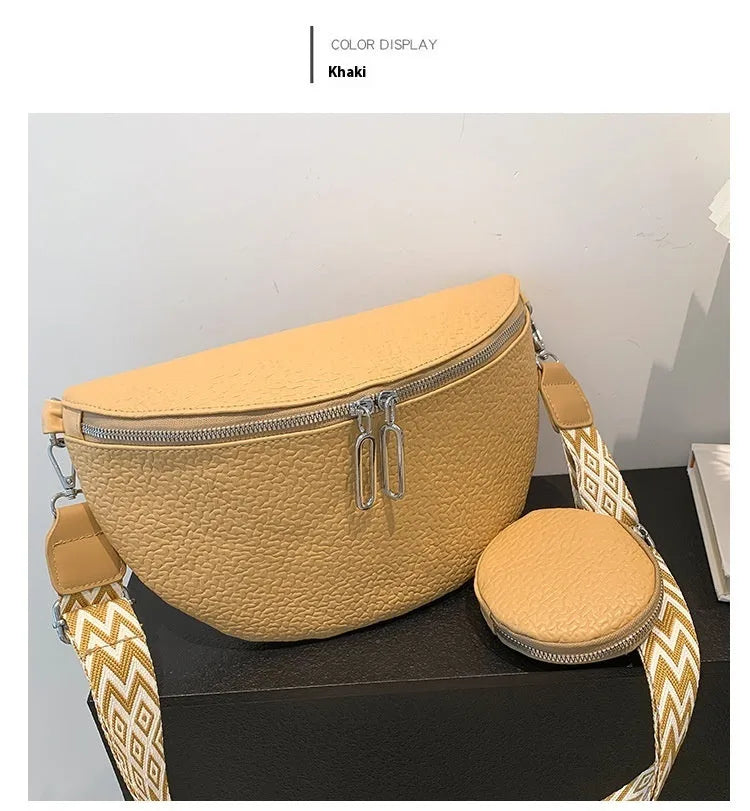 Women's solid colour PU crossbody bag with saddle lock zipper texture in clamshell design